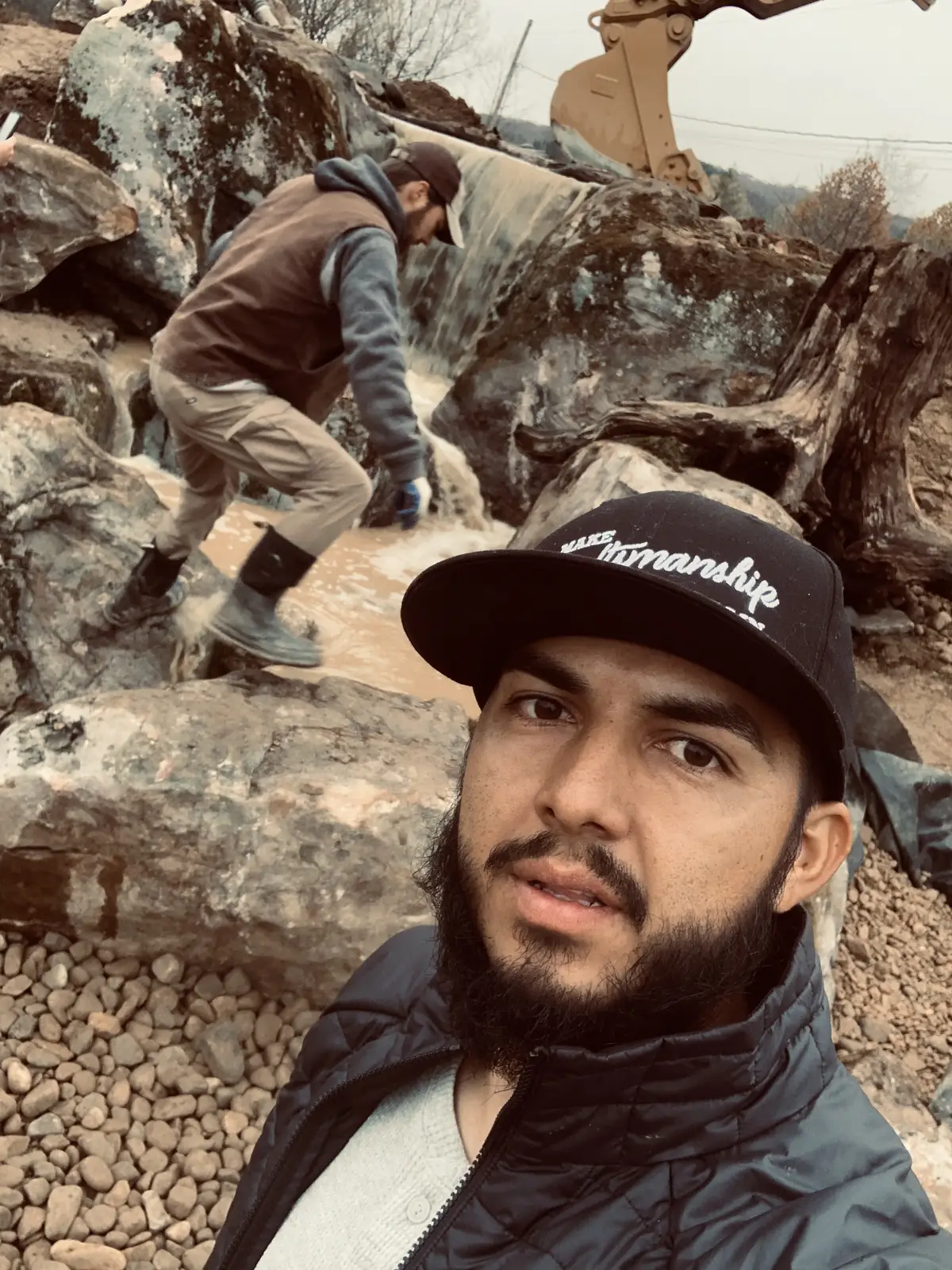 JR Ramirez, Founder and CEO of Fernweh Outdoor, at a finished waterfall project