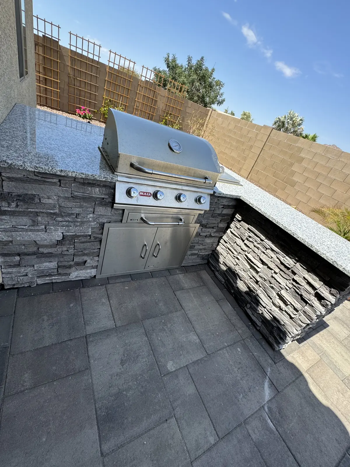 Outdoor kitchen stacked stone grill
