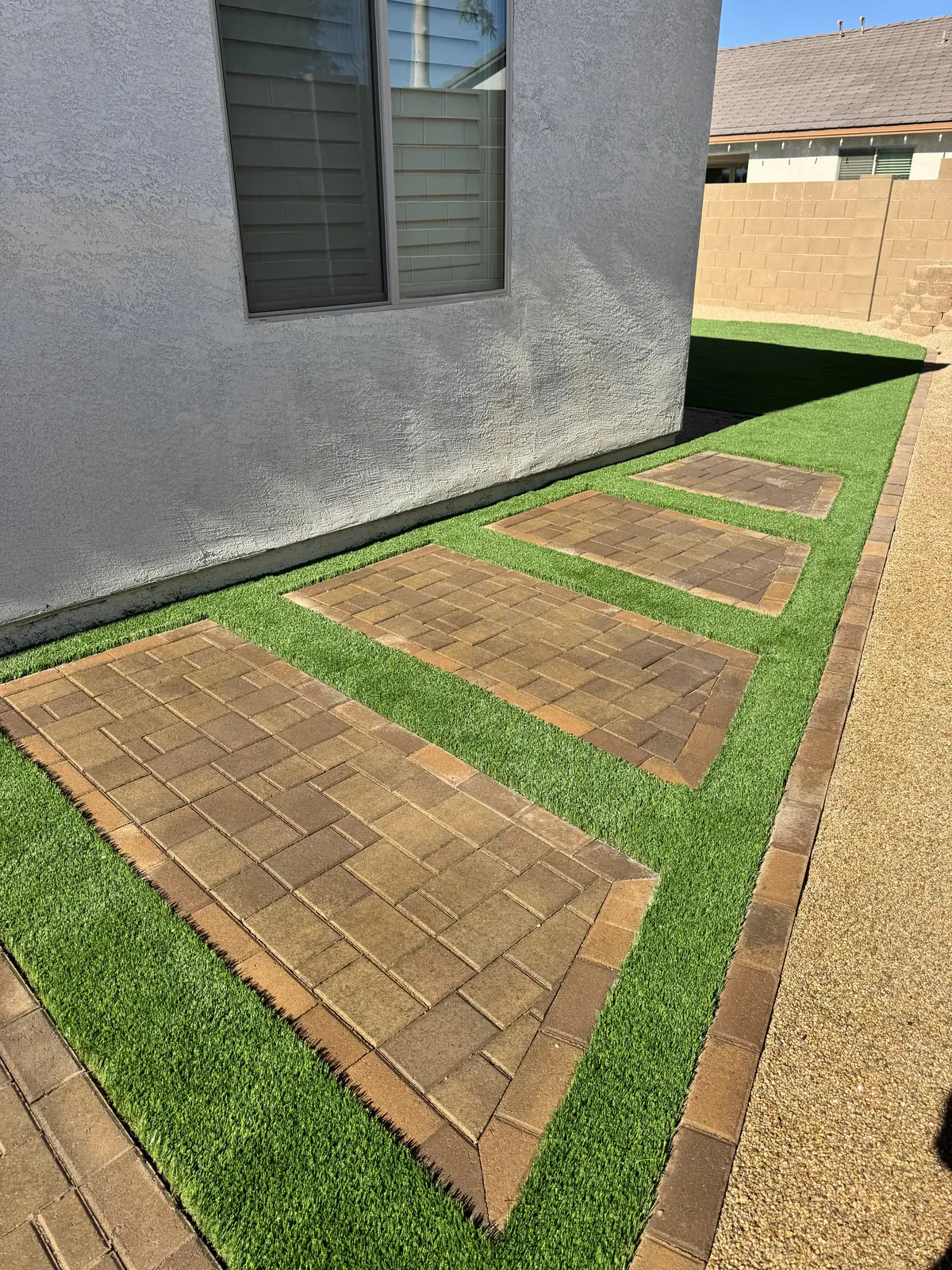 Turf with boulder border