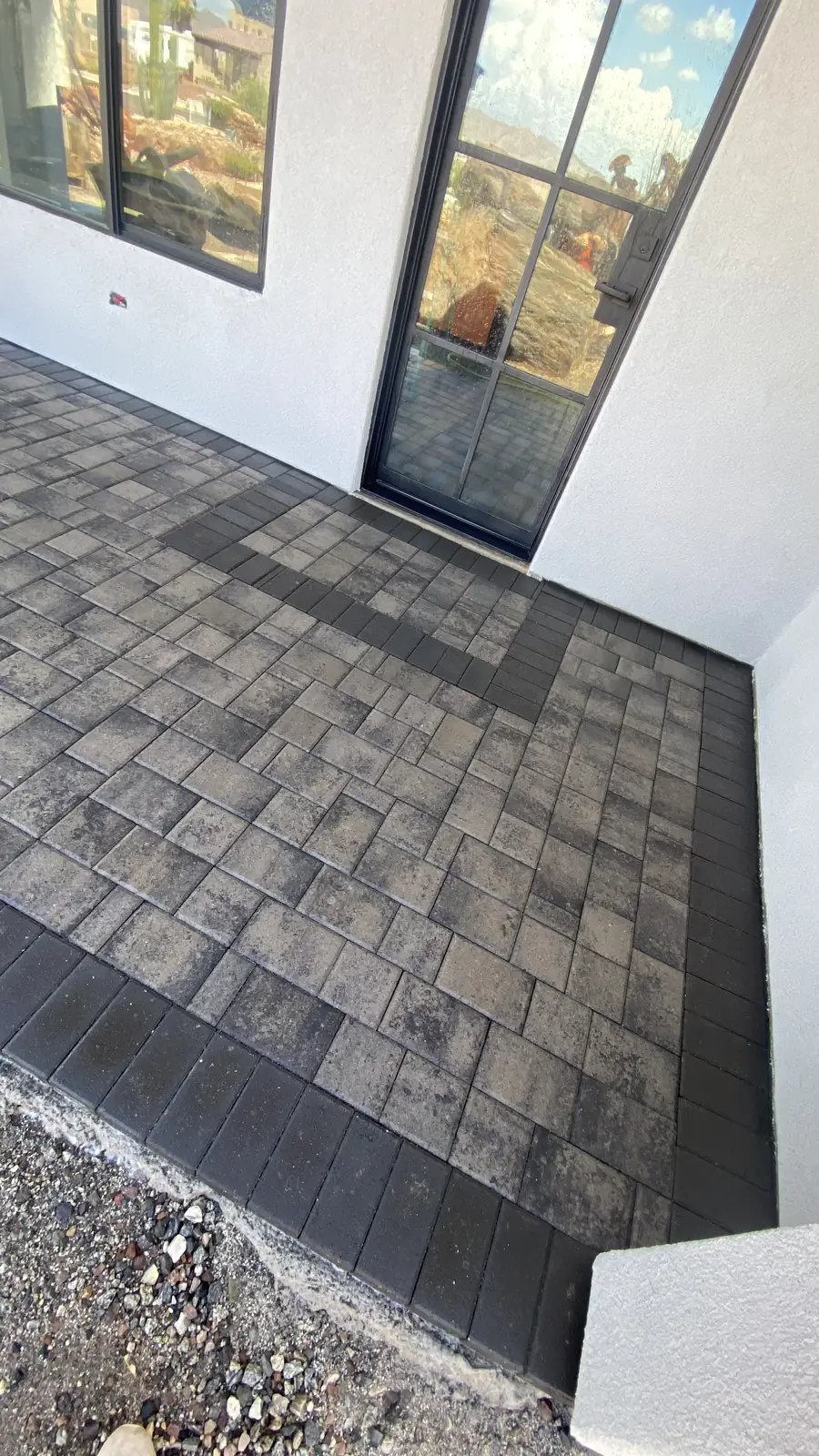 Paver walkway along house
