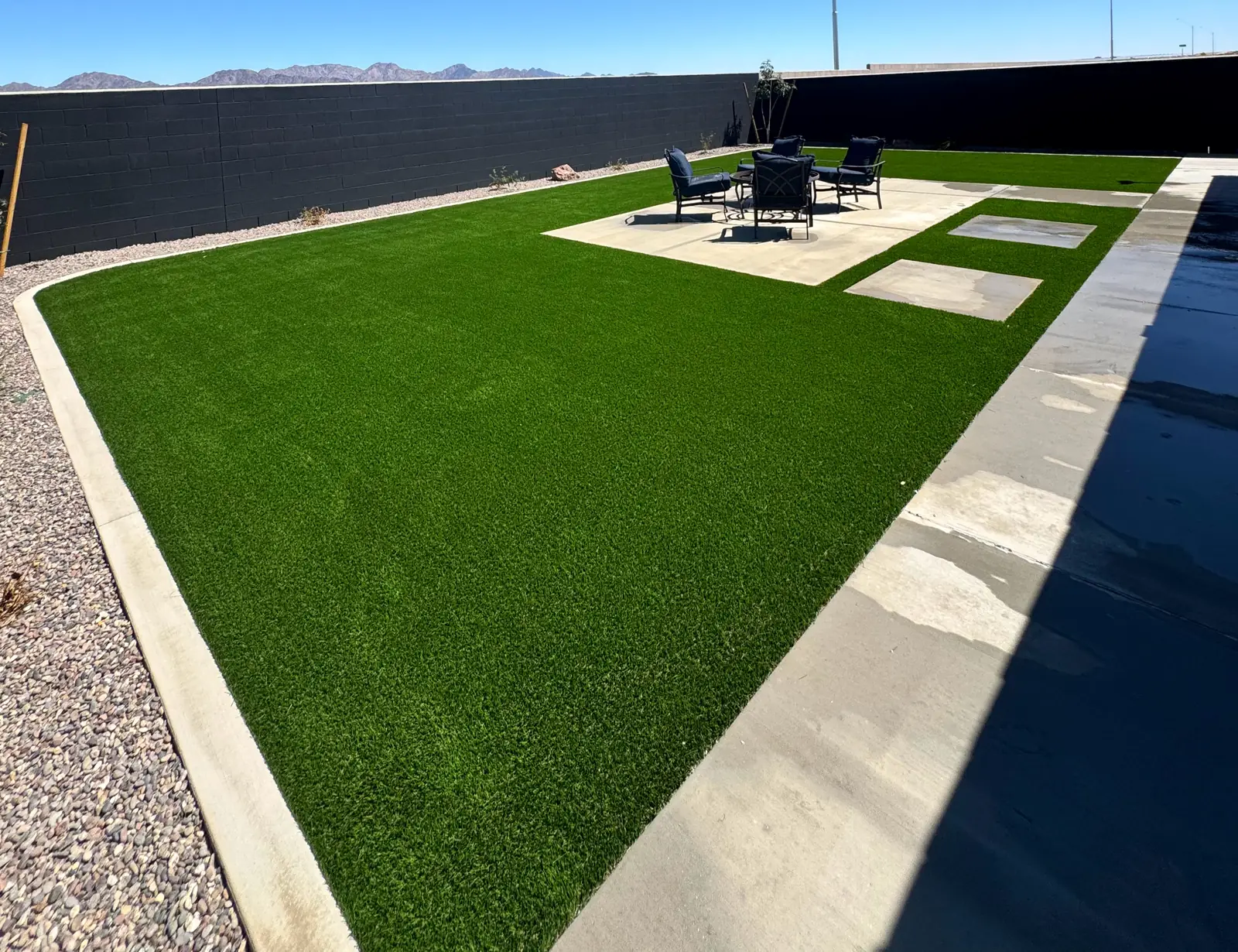 Artificial turf backyard patio seating