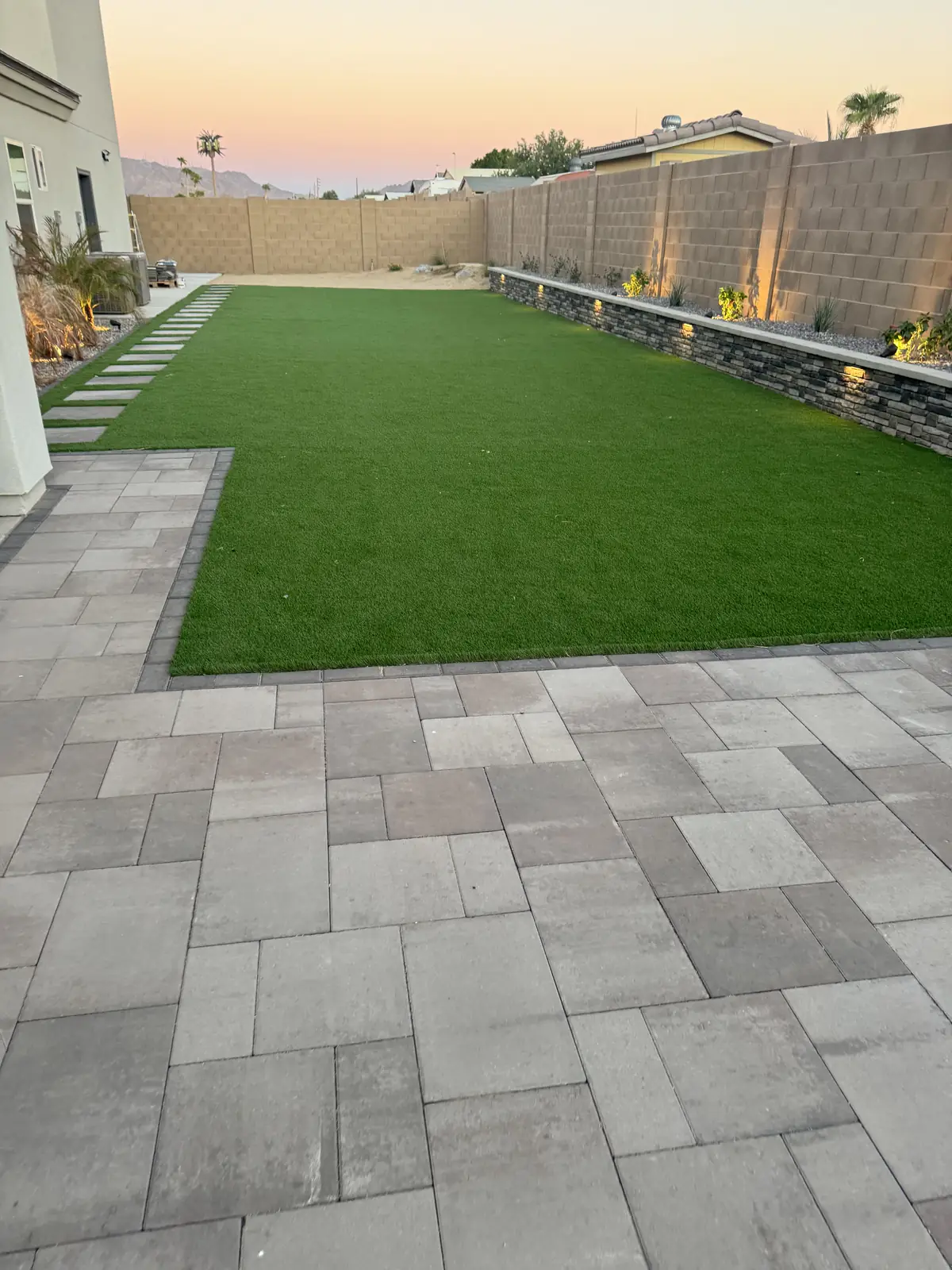 Artificial turf large format paver patio