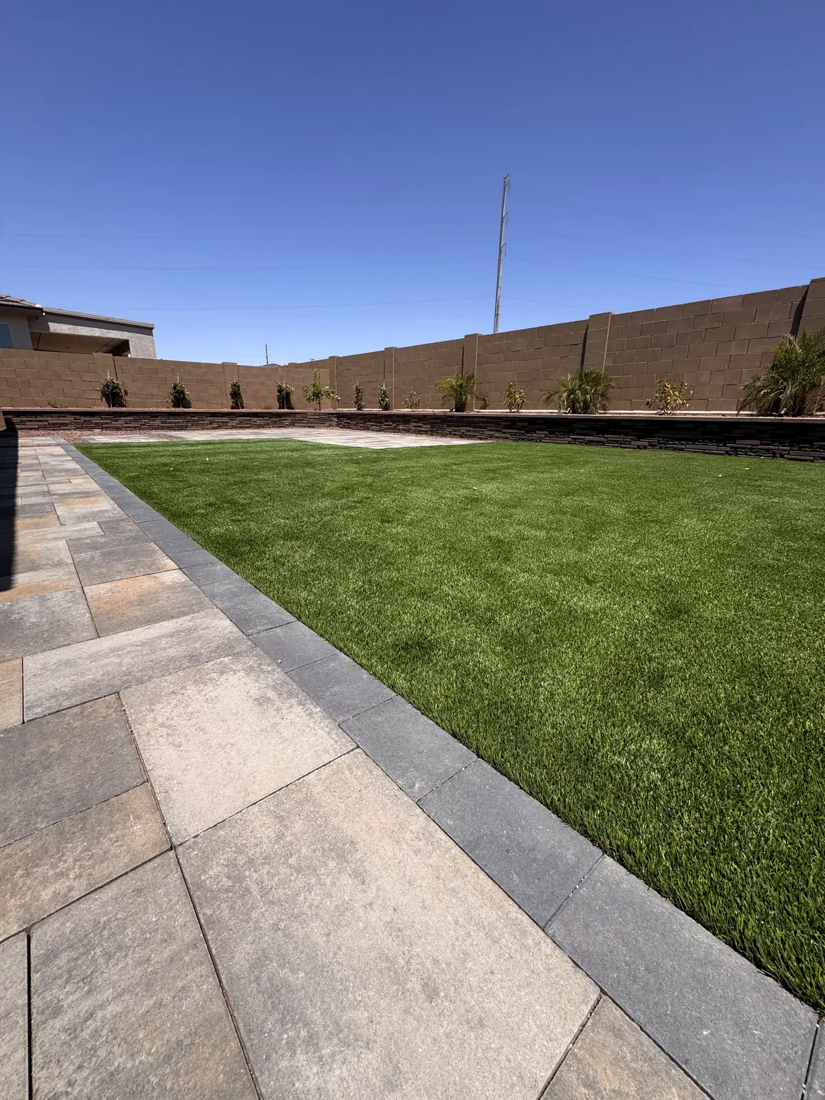 Artificial turf paver border
