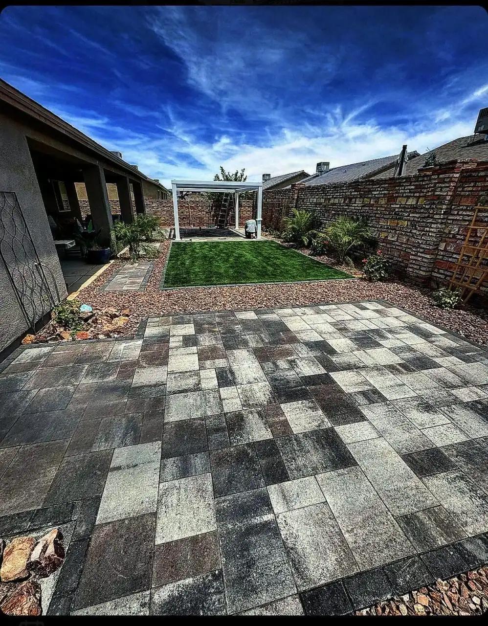 Paver checkerboard patio with turf inlay