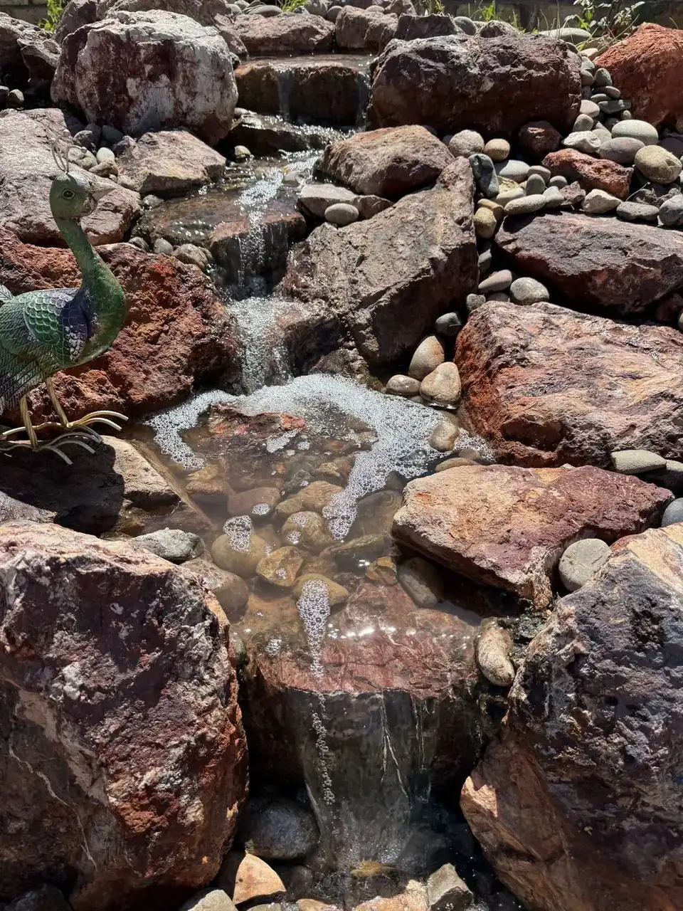 Water feature flow between boulders