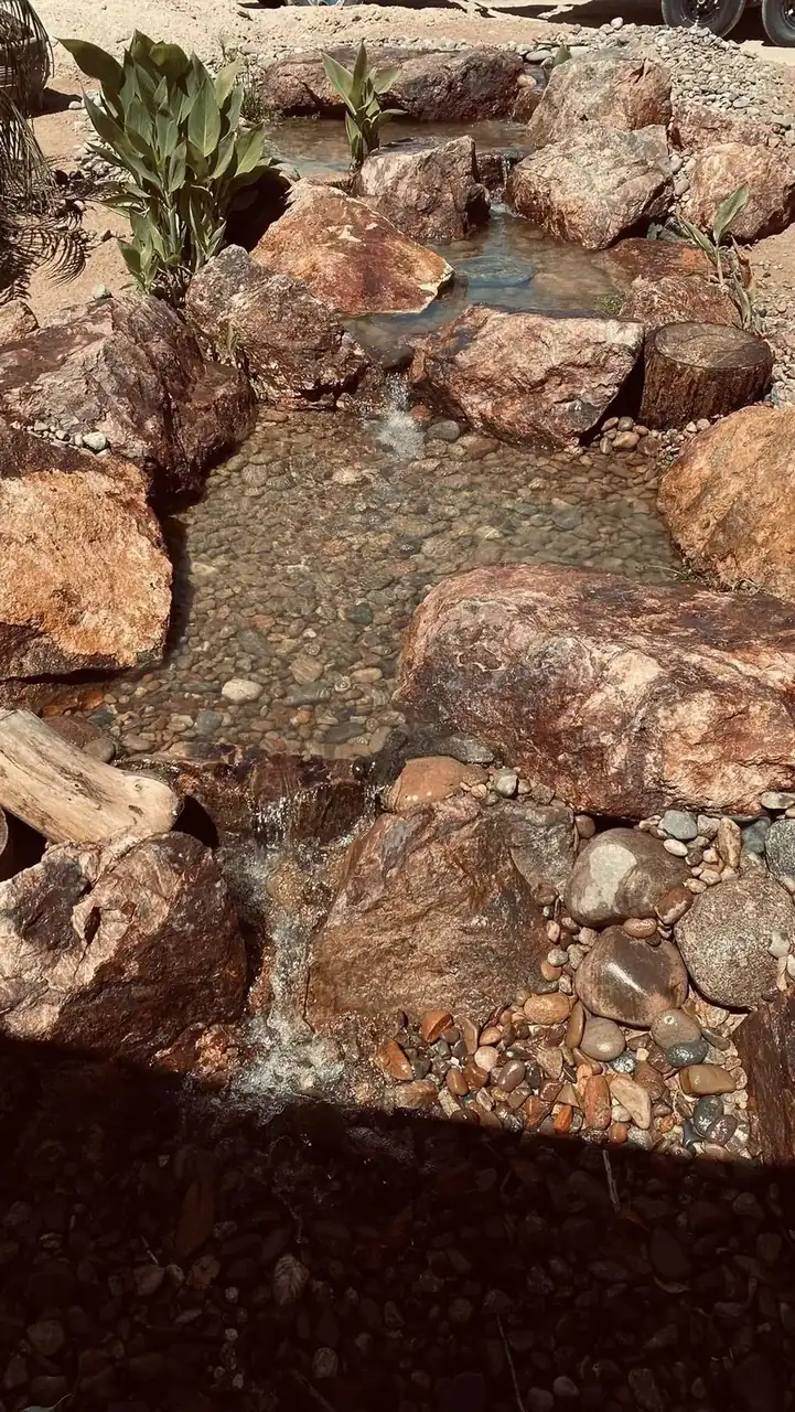 Large pondless waterfall with climbing boulders