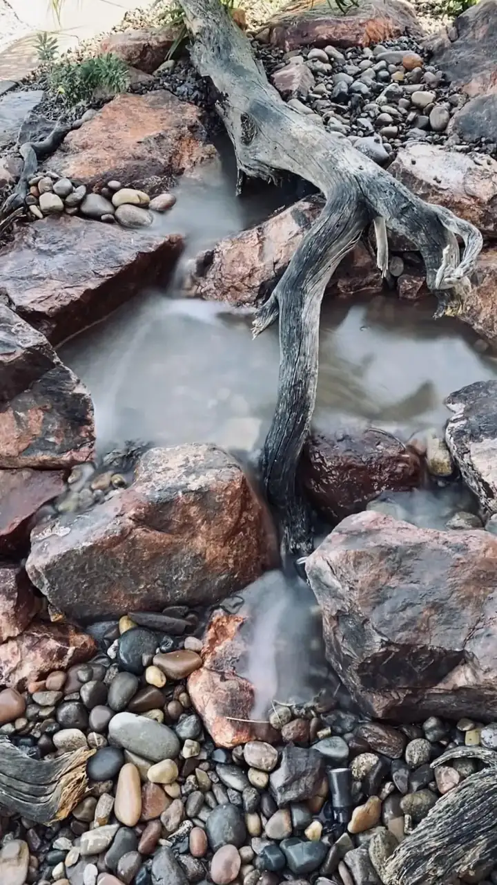 Small pondless waterfall with natural stone